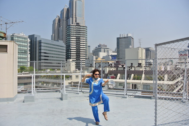 Barbara Matsuura practicing Qigong on a rooftop in Japan